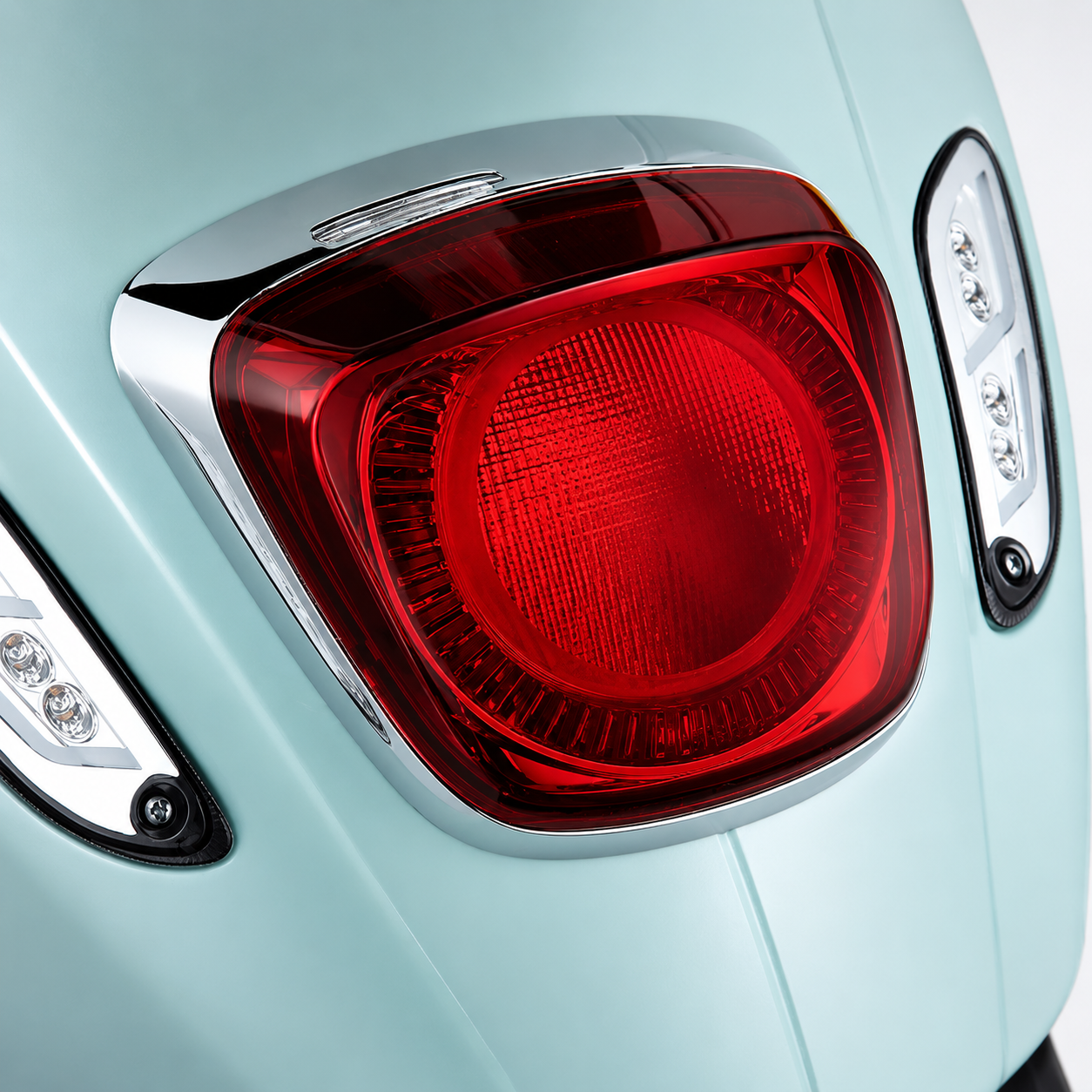 Premium LED rear tail light for Vespa Primavera and Sprint scooters displayed in multiple studio angles, close-up details, installed rear view, illuminated LED, and product housing on a clean white background.